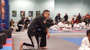 Mr. Kim watches belt test. 