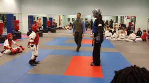 Blue belt sparring a black belt during IMA belt test.